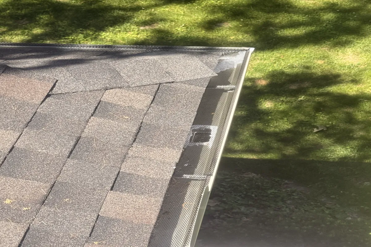 Installed metal gutters on a shingle residential roof in Madison